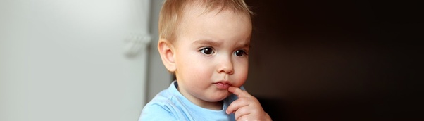 A young child looking thoughtful