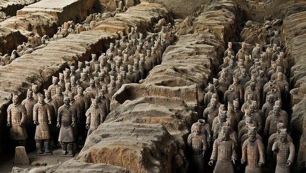 Ranks of Terracotta Army statues in an excavation pit