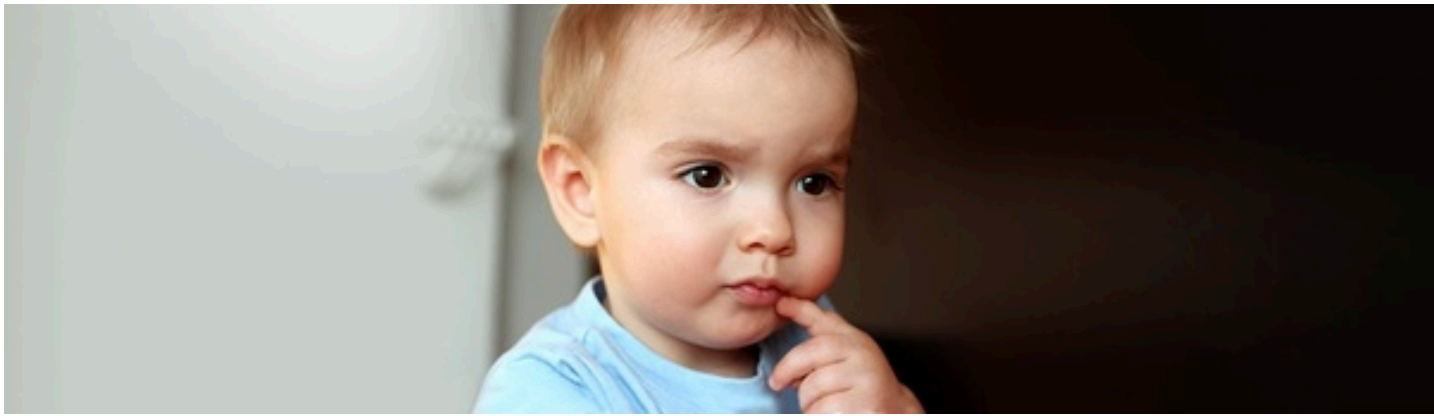 A young child looking thoughtful